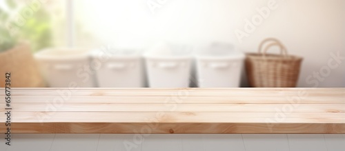 Blank wooden table in blurry Laundry room for showcasing or compiling your items © 2rogan