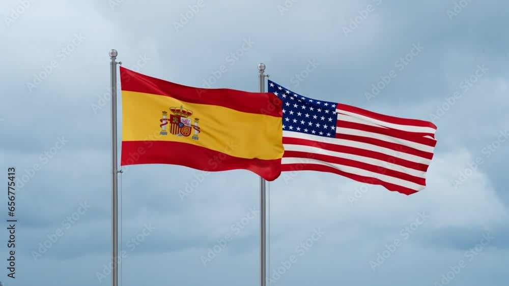USA and Spain flag waving together on cloudy sky, endless seamless loop, two country cooperation concept USA and Spain flag waving together on cloudy sky, endless seamless loop, two country cooperation concept