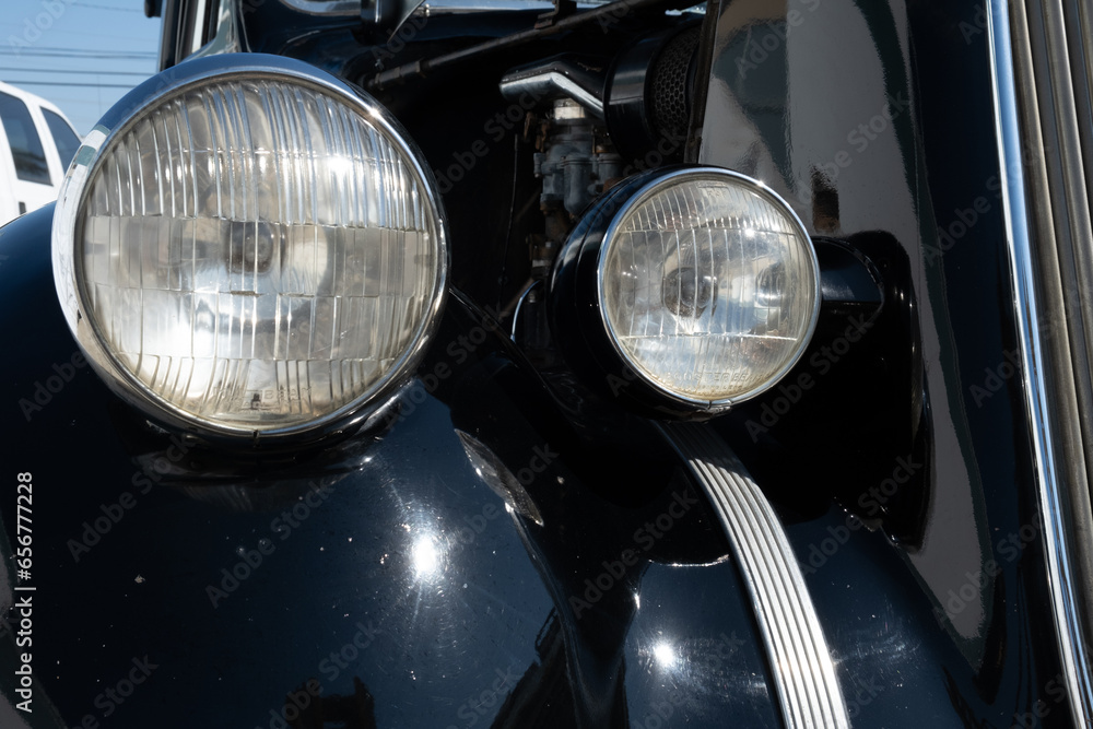 Vintage Car Headlights on Black Retro Vehicle
