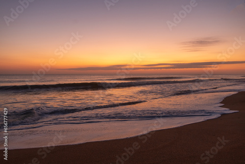 Fototapeta Naklejka Na Ścianę i Meble -  Sunrise on Florida beach, reflections on the sand