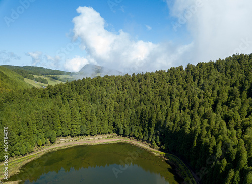 Aerial view of lake of Empadadas (Lagoa das Empadadas) in the middle of a green forest. Sete Cidades Sao Miguel island in the Azores photo