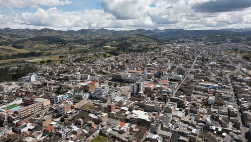 Tulcan is the capital of the province of Carchi located in Ecuador, aerial shot of the town in a sunny day. photo