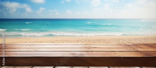 Editable wooden picnic table on beach background for showcasing summer products or travel advertisements