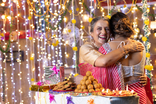 Photography Woman hugging her daughter on Diwali festival
