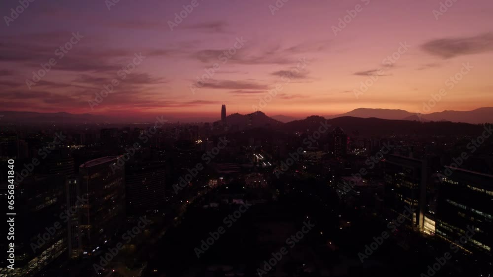 Panoramic aerial view of a sunset in Santiago Chile with orange colors and the modern architecture of the most outstanding city in Latin America. Panoramic aerial view of a sunset in Santiago Chile with orange colors and the modern architecture of the most outstanding city in Latin America.