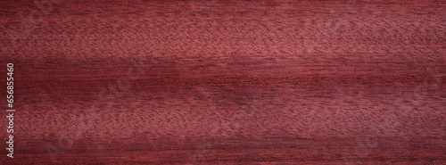 Closeup texture of wooden flooring made of Padauk photo