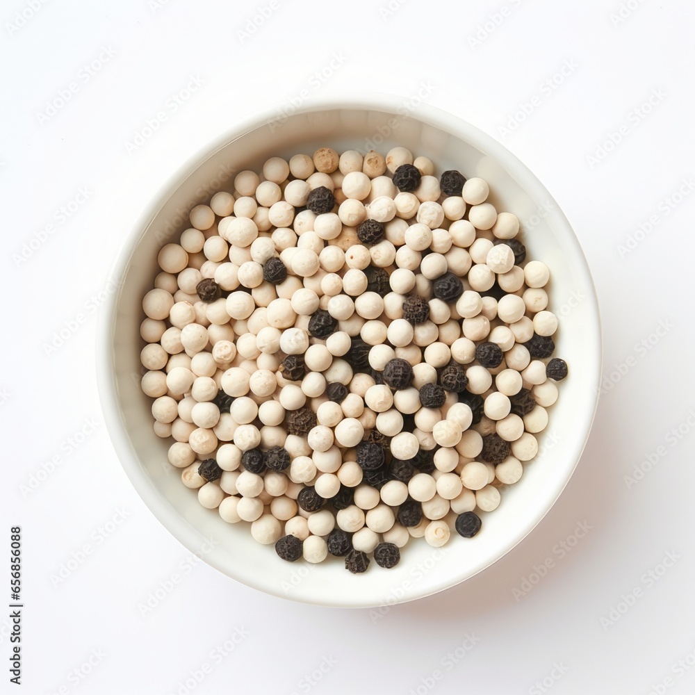 White and black pepper in bowl on a white background White and black pepper in bowl on a white background