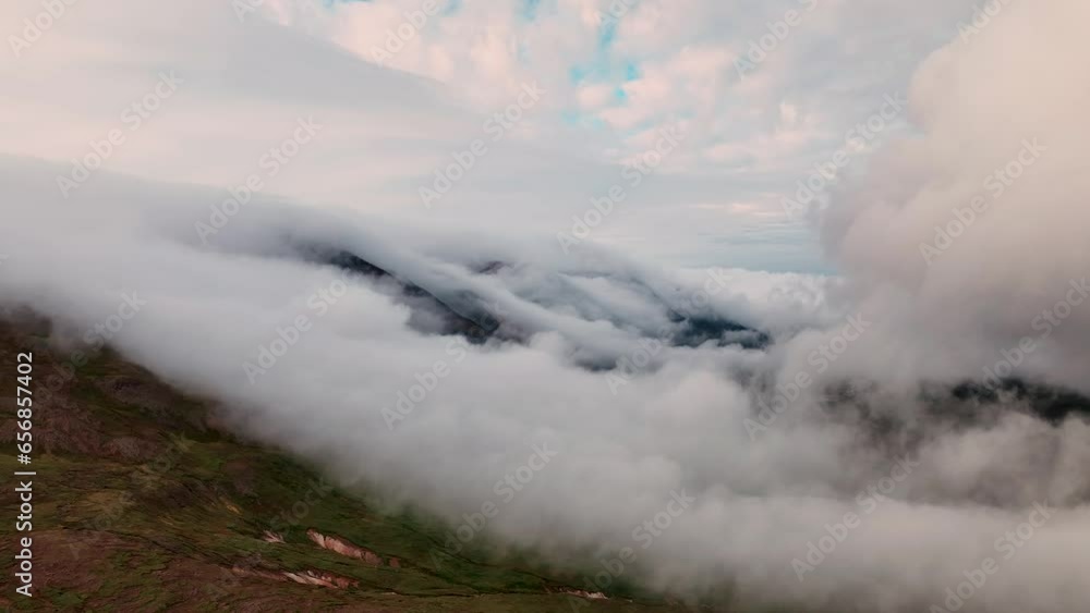 Clouds Rolling Over The Mountain Hills In East Iceland During Sunset. - aerial Clouds Rolling Over The Mountain Hills In East Iceland During Sunset. - aerial