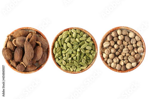 3 different types of cardamom seed pods from left to right Black cardamom, Green cardamom and Round Siam cardamon also called Camphor seed