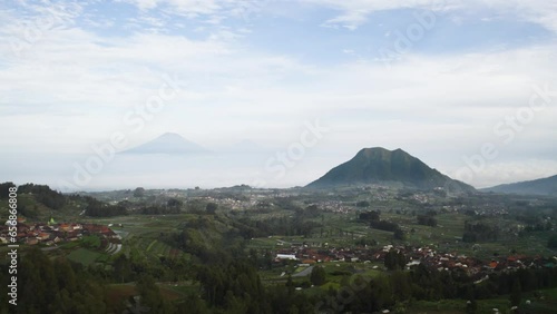 Beautiful scenery of residential houses with mountains photo