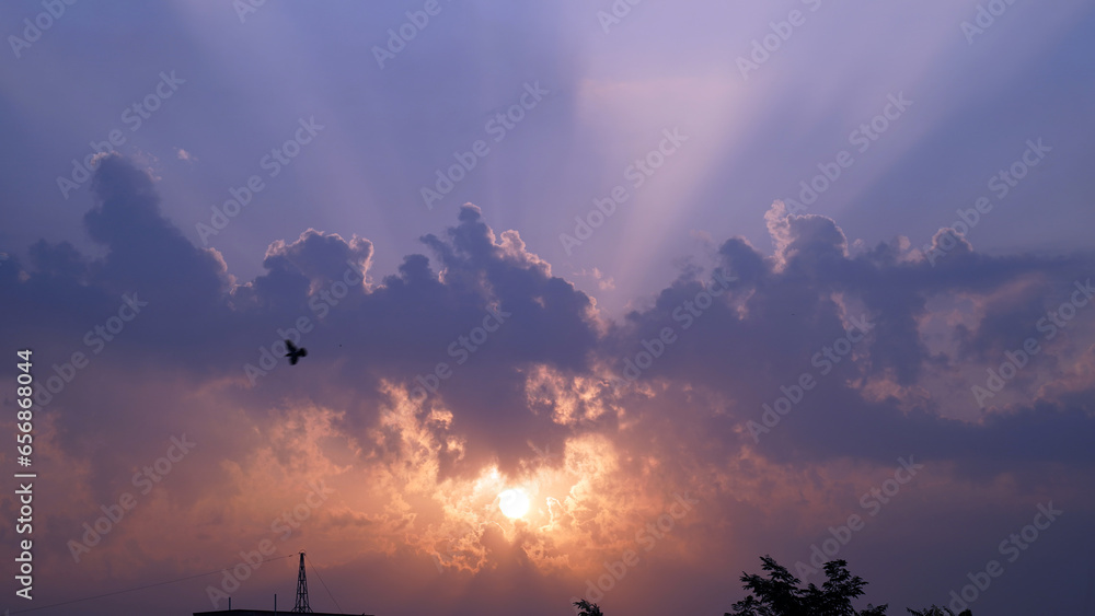 Dramatic Colorful Sunset or Sunrise Sky. Clouds with Sunrays. Cloudscape Nature Background. Panorama