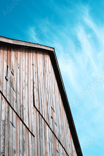looking up at the roof of an old barn in the sky