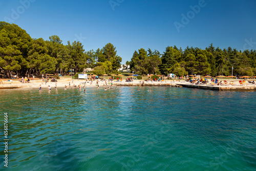 Beach on the stone coast of Spadici, Poreč, Istria, Croatia, Europe