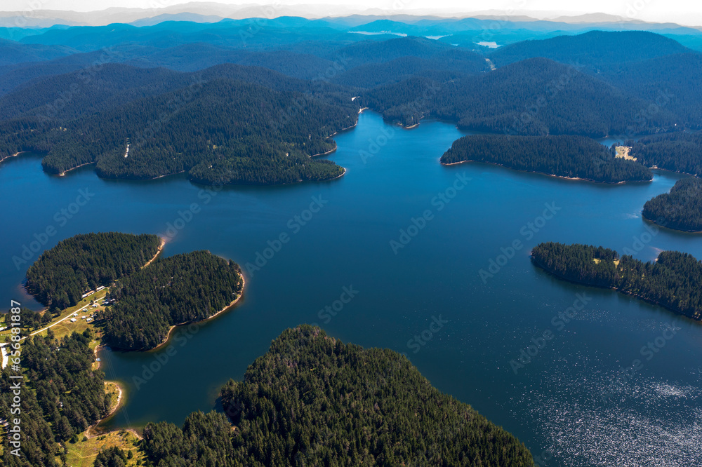 Obraz premium Stunning aerial view at Dam Shiroka Poliana, Bulgaria, Beautiful blue water and green forest.