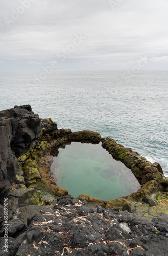 Brimketill lava rock pool in Iceland photo