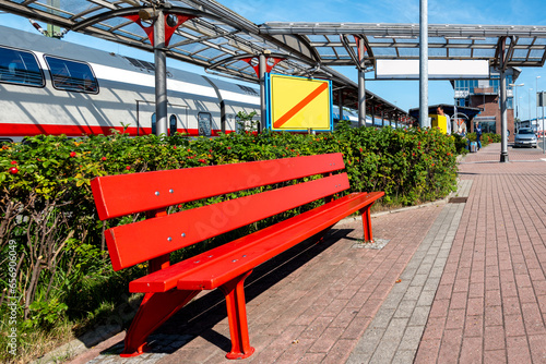 Emden Aussenhafen train station with red bench outside, Germany