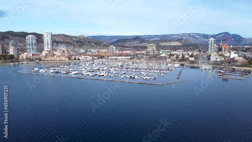 Aerial Drone Shot of the Beautiful of City Kelowna British Columbia. Downtown Kelowna Waterfront Catch Club and Boardwalk on a beautiful day. photo