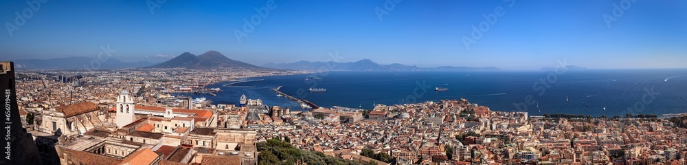 Obraz premium View of the Gulf of Naples. Naples and the Mount Vesuvius with Capri in the distance from the Castel Sant'Elmo.