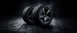 New Car Tires Against Dark Background, Auto Parts Advertisement . Сoncept Car Tires, Dark Background, Auto Parts, Advertisement