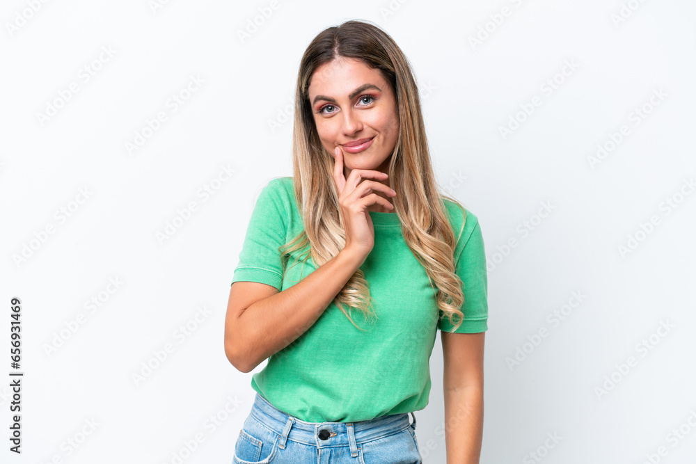 Young Uruguayan woman isolated on white background and thinking Young Uruguayan woman isolated on white background and thinking
