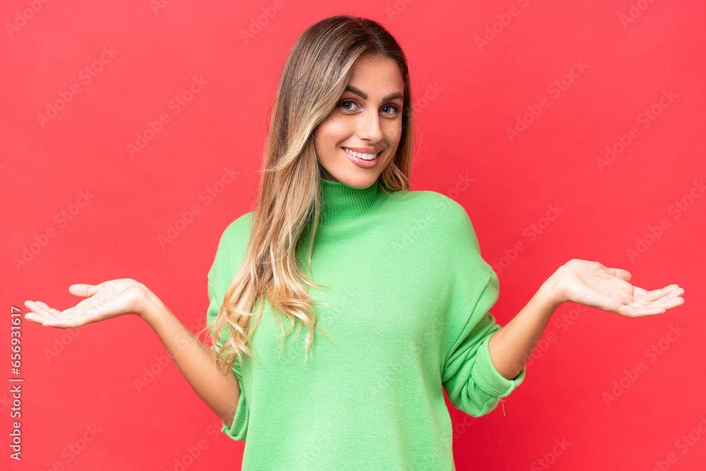 Young Uruguayan woman isolated on red background happy and smiling Young Uruguayan woman isolated on red background happy and smiling