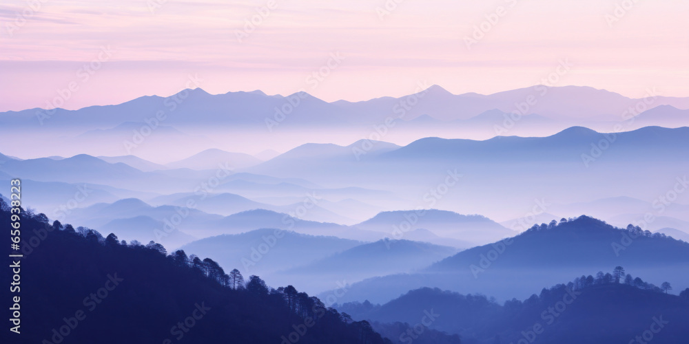 The mountains are shrouded in mist, and the last traces of daylight lend a tranquil, mystical quality to the scene. A twilight shot of autumn mountains under a fading pink and purple sky. The mountains are shrouded in mist, and the last traces of daylight lend a tranquil, mystical quality to the scene. A twilight shot of autumn mountains under a fading pink and purple sky.