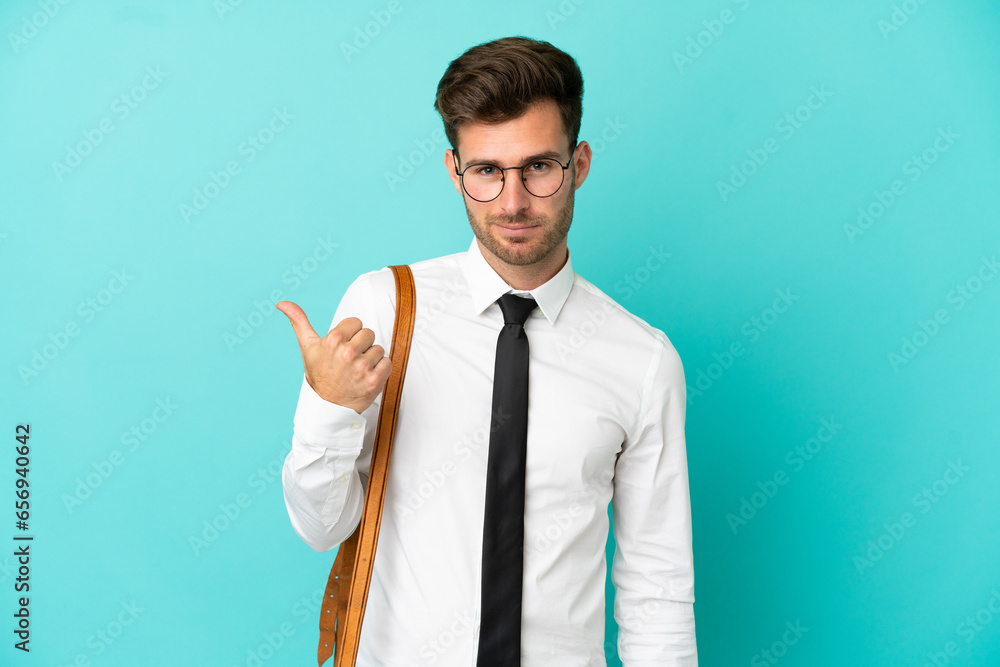 Business man over isolated background pointing to the side to present a product