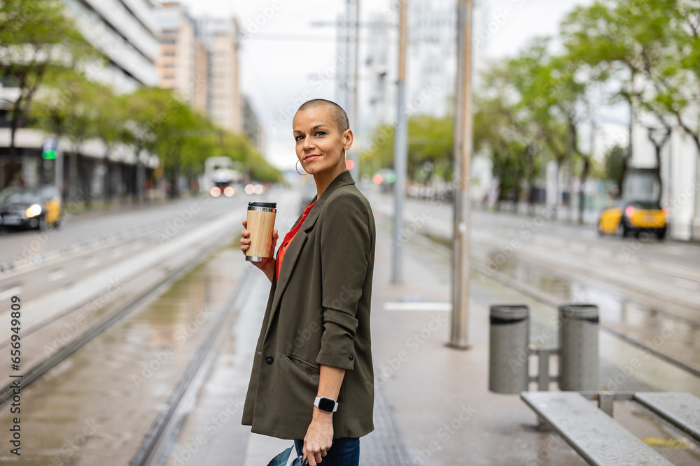 Woman waiting at tram station platform Woman waiting at tram station platform