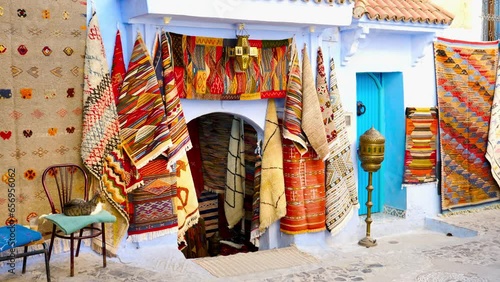 Traditional carpets on the blue Chefchaouen street- travel, tour tourism in Morocco