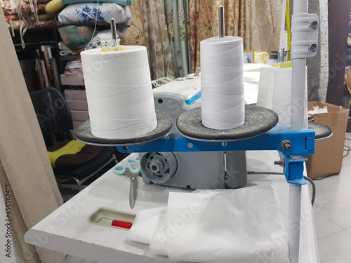 Sewing factory manufacture craft business with overlock sewing machine and white thread