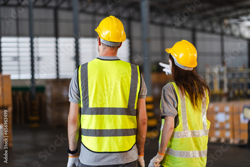 professional technician engineer checking mechanical factory equipment for using on industry machine, foreman with safety hard hat helmet working to maintenance control production job in manufacturing © chokniti