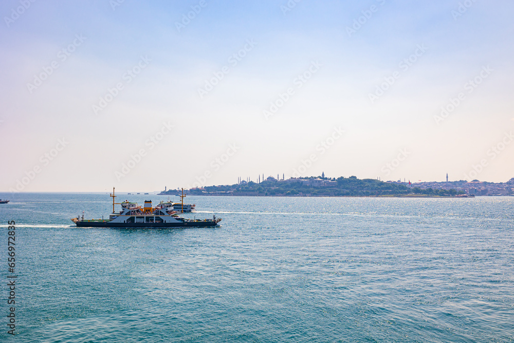 Istanbul view with a ferry boat from Maiden's Tower