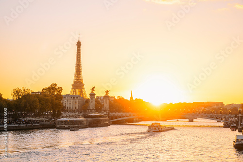 France, Ile-De-France, Paris, Seine river at sunset with Eiffel Tower and Pont Alexandre III bridge in background