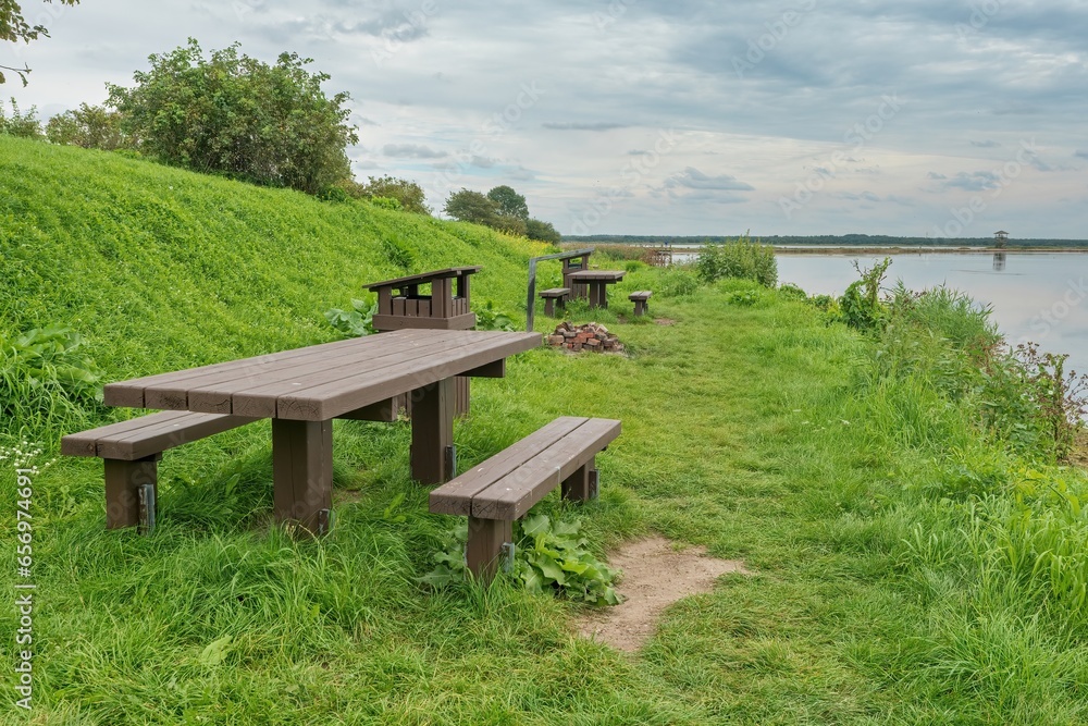 Picnic area by the river. Nice view from the top. Latvian nature. Positive photo. Picnic area by the river. Nice view from the top. Latvian nature. Positive photo.