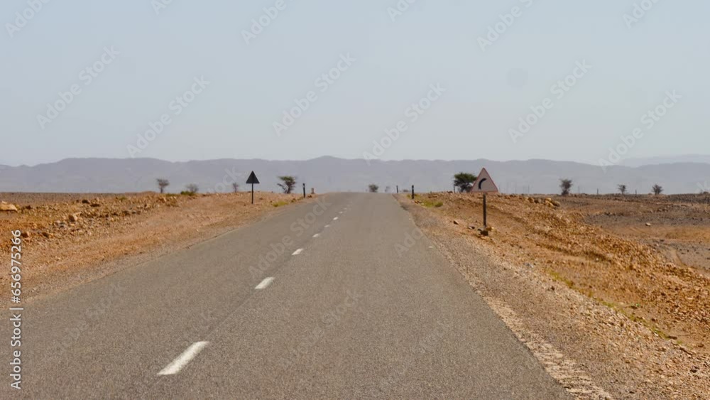 empty asphalt desert road in Morocco empty asphalt desert road in Morocco