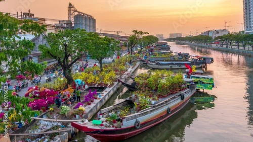 Time lapse bustle of buying flowers at flower market, locals buy flowers for decoration purpose the house on Lunar New Year in Ho Chi Minh City, Vietnam