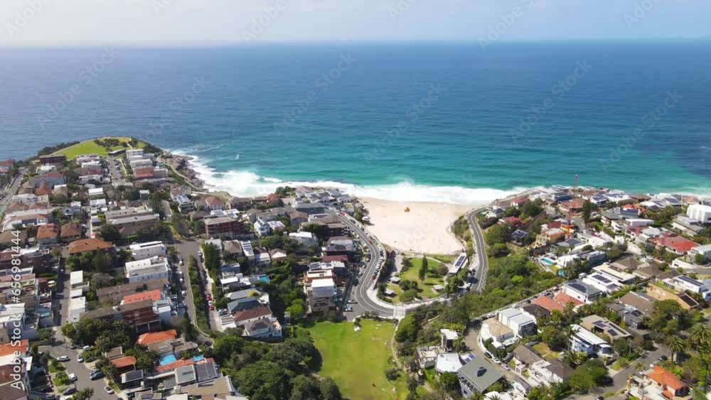Aerial drone view of homes and streets above the beachside suburb of Tamarama, looking toward Tamarama Beach in east Sydney, NSW Australia on a sunny morning Aerial drone view of homes and streets above the beachside suburb of Tamarama, looking toward Tamarama Beach in east Sydney, NSW Australia on a sunny morning