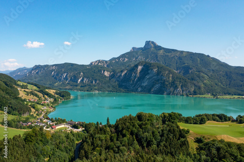 Austria, Upper Austria, Auhof, Drone view of Mondsee lake and surrounding mountains in summer photo