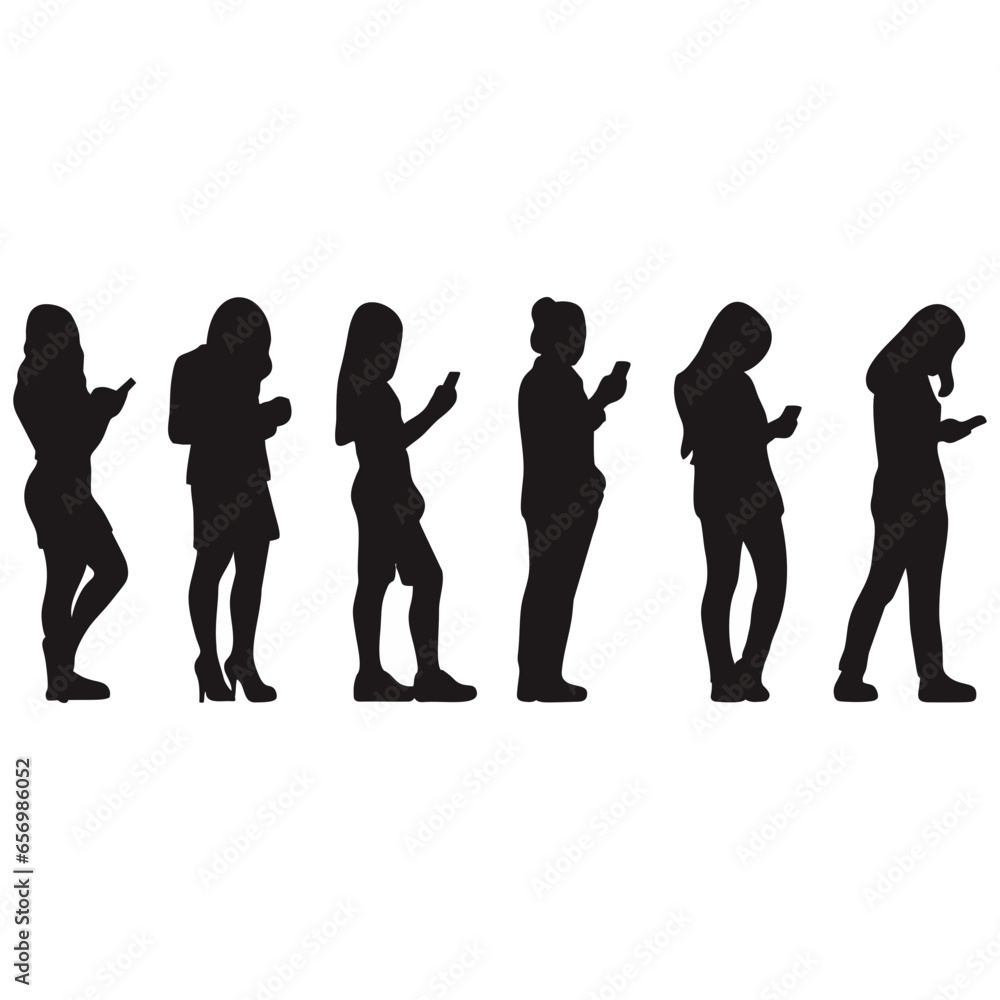 Silhouette of a woman standing playing with a cellphone