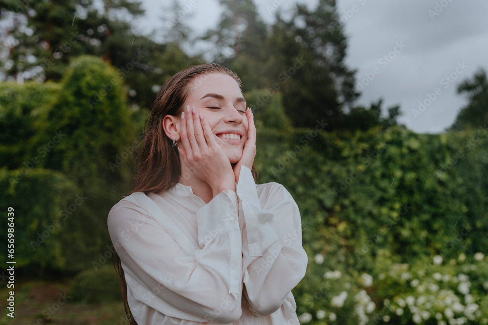 Smiling woman spending leisure time in rain Smiling woman spending leisure time in rain