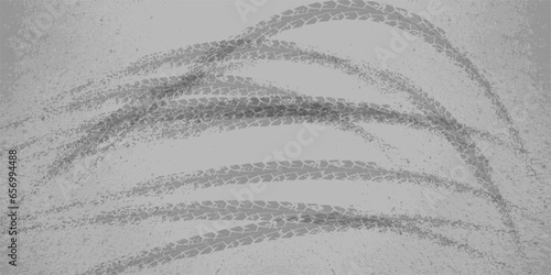 Gray background with traces of tire skidding on a turn on an asphalt road. Grunge abstract vector background