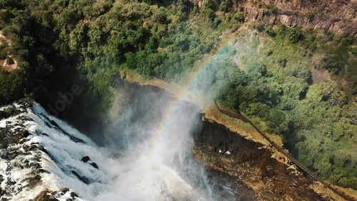 Aerial View Victoria Falls, Shungu Namutitima at the Border of Zimbabwe and Zambia in Africa. The Great Victoria Falls One of the Most Beautiful Wonders of the World. 4K UHD Aerial Dron Shot. photo
