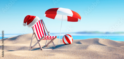 Fototapete Beach chair with Santa Claus hat at summer beach with umbrella - 2024 holiday co