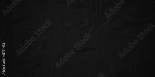Dark crumple black fabric paper wrinkled poster template ,blank glued creased paper texture background. black paper crumpled backdrop background. used for cardboard and clarkboard. 