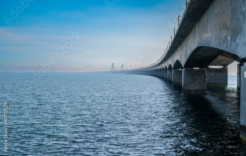 Big concrete bridge over the blue sea