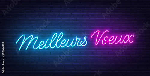 Meilleurs Voeux neon lettering on brick wall background. Best wishes in French.