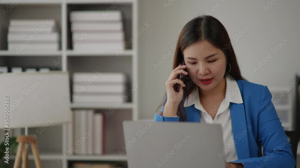 Businesswoman in blue sky suit is talking to clients and colleague on the phone. Businesswoman in blue sky suit is talking to clients and colleague on the phone.