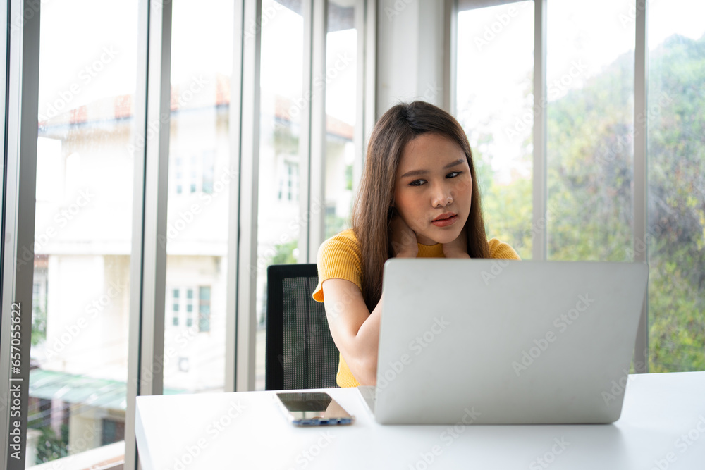 Beautiful young Asian businesswoman, shoulders and back pain during work long time on workplace. Body muscles stiff problem after long day work and overworked. Office syndrome and Healthcare concept. Beautiful young Asian businesswoman, shoulders and back pain during work long time on workplace. Body muscles stiff problem after long day work and overworked. Office syndrome and Healthcare concept.