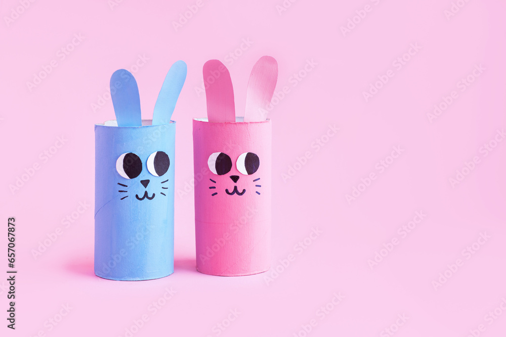 Holiday easy DIY craft idea for kids. Toilet paper roll tube toy's cute rabbit's on minimal background banner. Creative Easter, Christmas decoration eco-friendly, reuse, recycle handmade concept