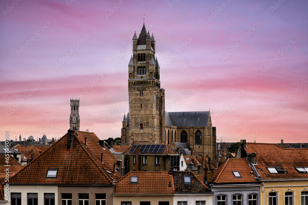 Naklejka premium BRUGES, BELGIUM amazing historic city that enchants tourists visitors with its picturesque canals historic medieval architecture towers and medieval charmand tour The Bruges horsecar 